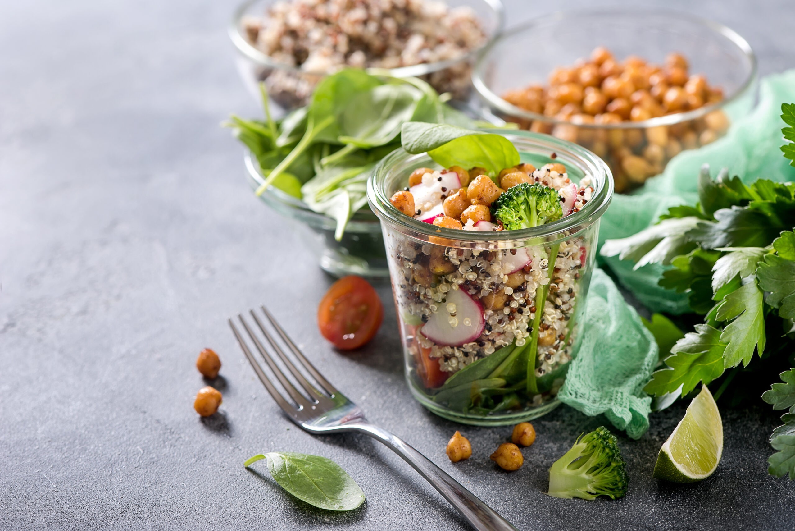 Quinoa salad with chickpeas in mason jar, spinach, veggies, healthy vegan food, dieting, clean eating, vitamin and protein snack Quinoa salad with chickpeas in mason jar, spinach, veggies, healthy vegan food, dieting, clean eating, vitamin and protein snack